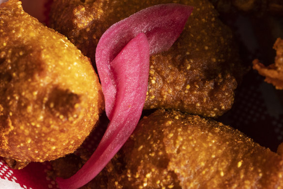 Hush puppies: four comets of deep-fried cornmeal that’s sweet, savoury and soft and doused with a life-giving honey butter. 