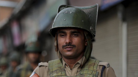Indian soldiers patrol in Srinagar, India, on Sunday amid rising tensions.
