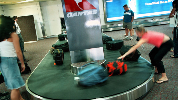 The woman was arrested over the theft of 18 items of luggage from carousels at Melbourne airport.