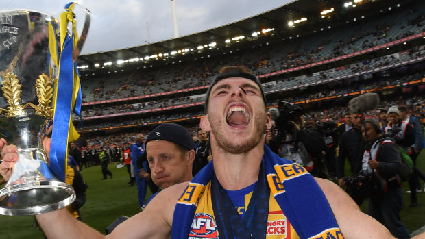 Spoils of victory: Luke Shuey laps the MCG with the premiership cup.