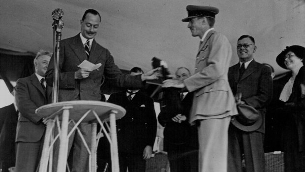 The Duke of Gloucester handing over the Royal Mail Bag at the opening of the air mail service to England.