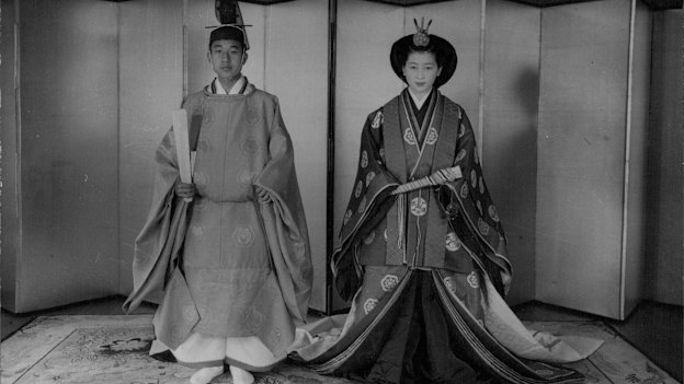Akihito and Michiko in their wedding costumes (his was red, hers was orange).  