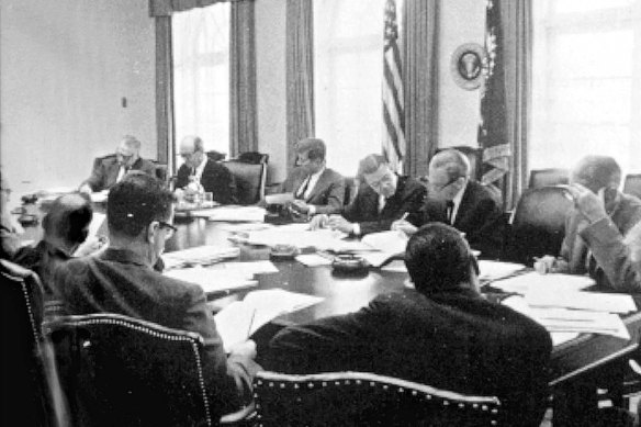 The Cuban missile crisis. John F.  Kennedy meeting with advisers. Nuclear technology helped prevent a third world war in the 20th Century.
