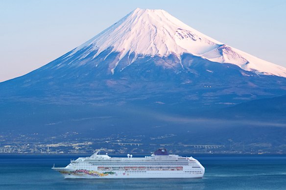 Norwegian Sky sailing past Mount Fuji in Japan.