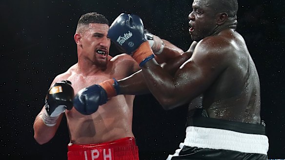 Justis Huni connected with Arsene Fosso as he defended his Australian heavyweight title in December.