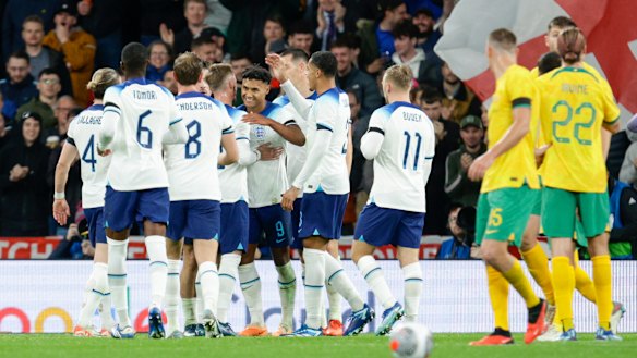 The Socceroos look on as England celebrate Ollie Watkins’ goal at Wembley.