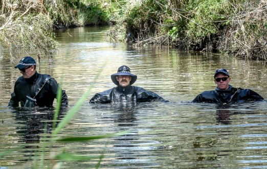 Police searching an area of bushland and Darebin Creek west of Sheehan Road in Heidelberg West. 