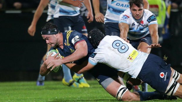 Try and mighty: Tom Franklin crosses for the Highlanders on Friday night.
