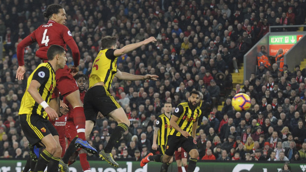 Liverpool's Virgil van Dijk scores his side's fifth goal against Watford.