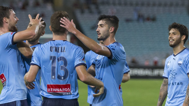 Dream debutL Jacob Tratt celebrates scoring for Sydney FC, five years after joining the club.