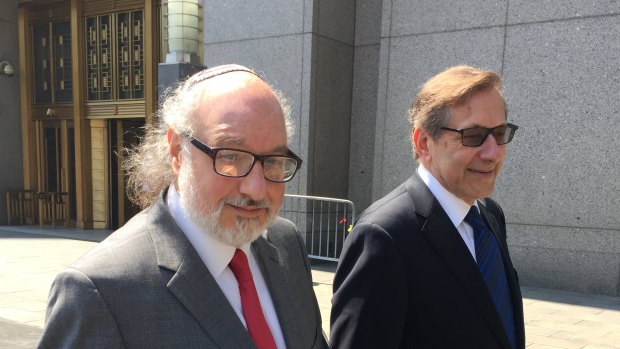 Convicted spy Jonathan Pollard, left, with his lawyer, Eliot Lauer, leaves federal court in New York following a hearing in 2016.