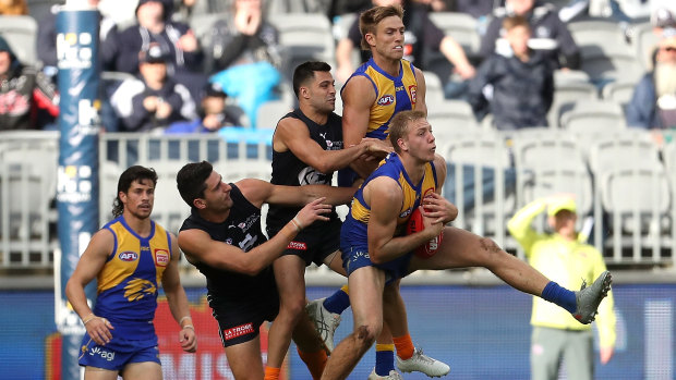 First served: Oscar Allen marks ahead of the pack during West Coast's win over Carlton at Optus Stadium in Perth.
