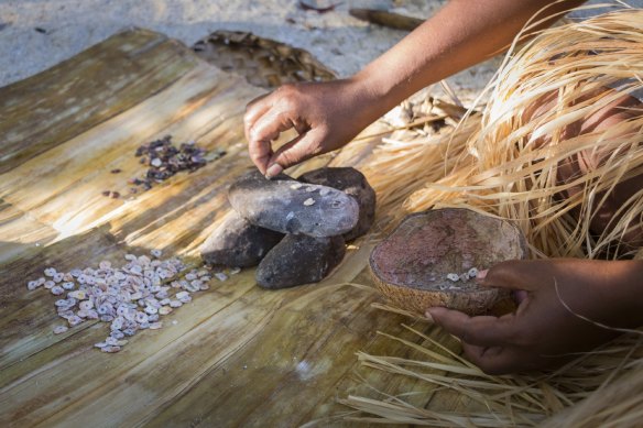 Locals keep the tradition alive by demonstrating how to make shell money.