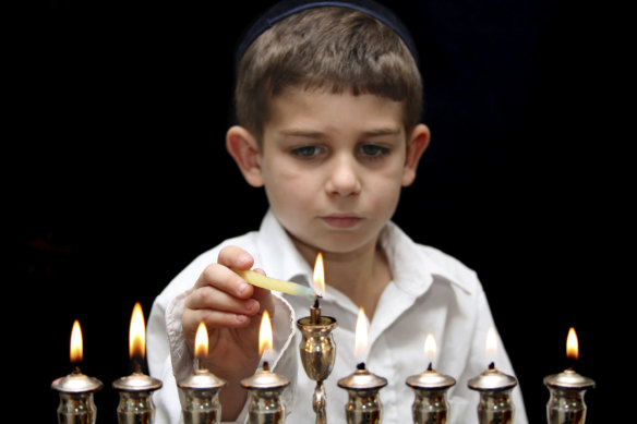 Lighting the menorah.