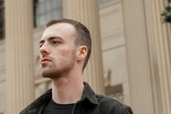 Gun violence survivor Alexander Denza in front of Wilson Library at the University of North Carolina at Chapel Hill.