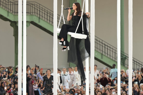 Chanel ambassador Riley Keough takes to a swing for the ready-to-wear show at the Grand Palais, Paris.