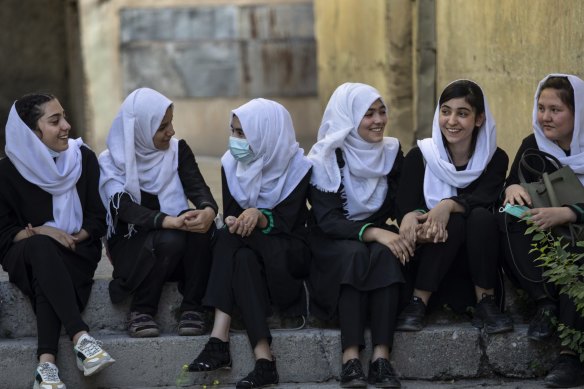 Women students at one of the largest high schools in Kabul photographed only a month ago before the Taliban retook the capital.