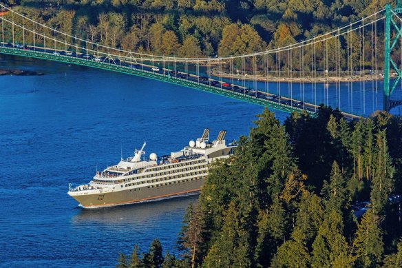 Ponant ship Le Soleal sailing under Lions Gate Bridge in Vancouver Harbour.