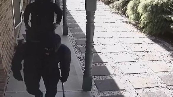 Masked men wield firearm and crowbar in home invasion