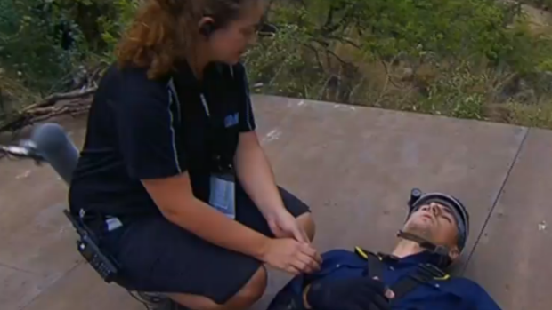 Beranrd Tomic is looked after by a medic during a tucket trial.