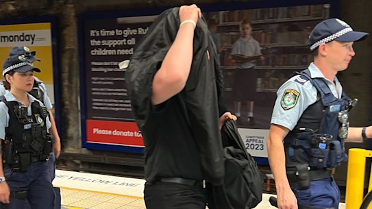 Police questioned men wearing black at North Sydney train station on Australia Day.