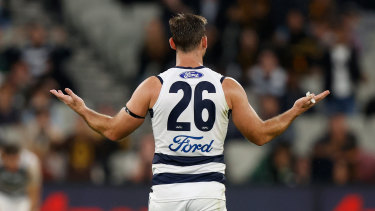 Tom Hawkins holds his arms out after giving away a 50-metre penalty.