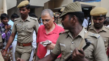 Art dealer Subhash Kapoor is brought into court in India in 2012.