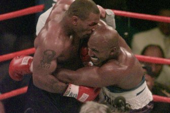 Mike Tyson bites off part of Evander Holyfield’s ear in their 1997 ‘bit fight’.