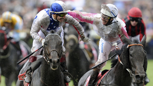 Gerald Mosse is congratulated by Luke Nolen after winning the Melbourne Cup on Americain in 2010.