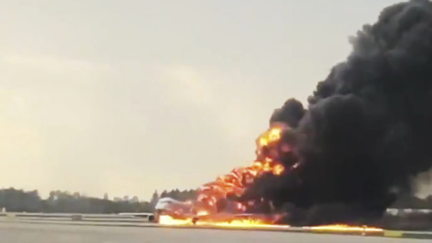 This image taken from video on the Twitter feed of Mikhail Norenko shows smoke from a plane on fire at Moscow's Sheremetyevo Airport.