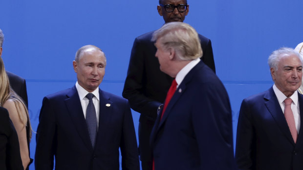 Eye off: Russian state TV reported that Vladimir Putin and Donald Trump did not greet each other.