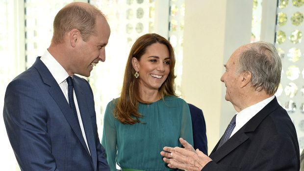Prince William and Kate, Duchess of Cambridge meet with The Aga Khan during a visit to the Aga Khan Centre, in London last year. The religious leader wired millions to the scammers.