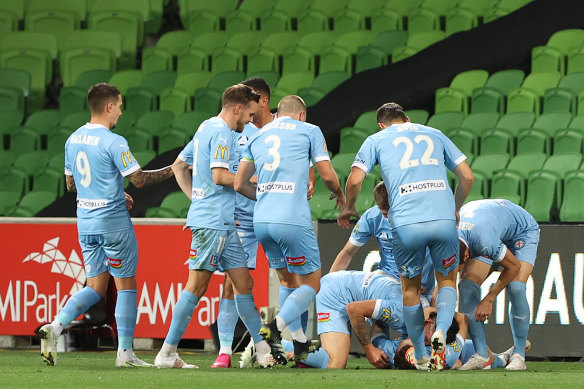 Melbourne City players celebrate after Scott Galloway’s goal to seal their win over Brisbane.
