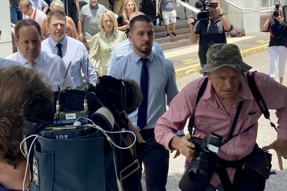 NT police officer Zachary Rolfe (centre) outside court in Darwin.