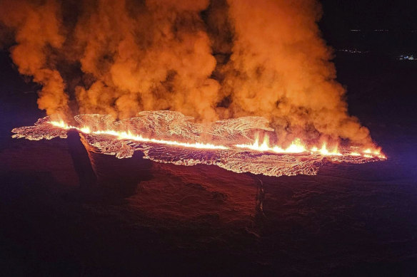 Lava spills from a volcano near Grindavík on Sunday. 