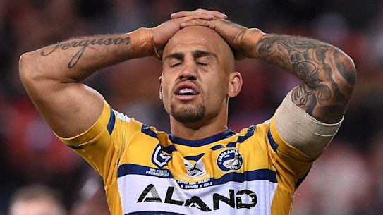 Old-fashioned hiding: Blake Ferguson reacts following another Storm try.