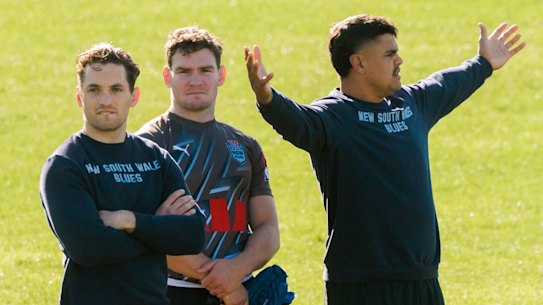 Cameron Murray, Liam Martin and Latrell Mitchell watch NSW training on Wednesday as they race the clock to be fit for game two.