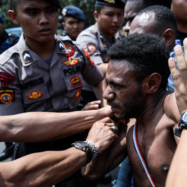 Police block Papuan protesters in Jakarta on August 22.