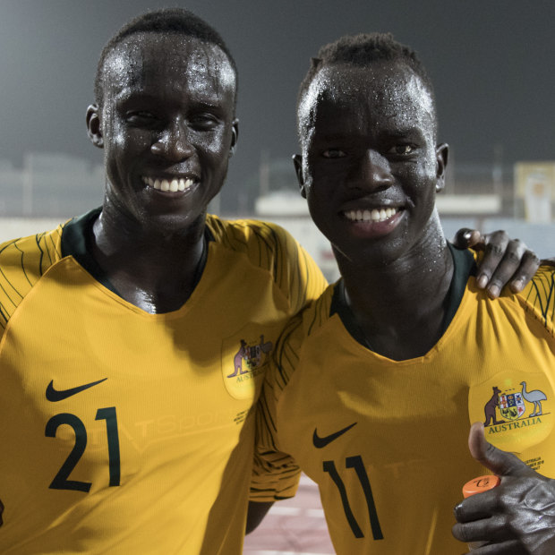 Thomas Deng (left), 21, debuted for the Socceroos alongside childhood friend Awer Mabil last year.