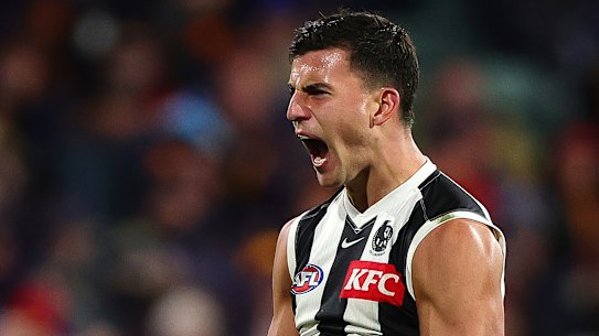 Nick Daicos comemora um gol.