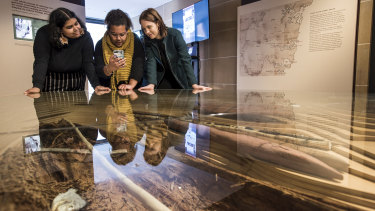 An augmented reality app brings Indigenous history to life with stories and interactive activities.  It was developed by Troi Ilsley, left, Aiesha Saunders, centre, and Marlee Silva right. 
