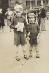 Brothers Frank and Pat Doughty at Circular Quay in 1943. Their mother sent the image to her husband who was in the Royal Australian Navy in World War II. The brothers are holding potato crisps, Spuds.