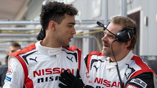 Archie Madekwe (left) plays a gamer who becomes a real-life racing car driver, while David Harbour plays his mentor in Gran Turismo.