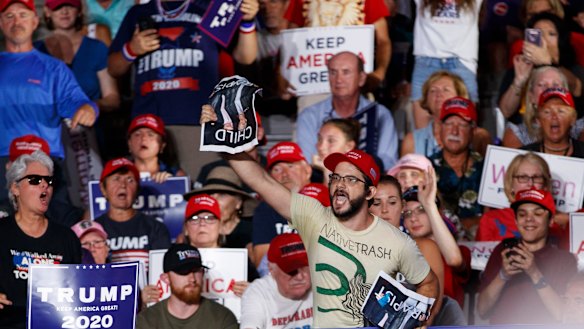 A protester calls out as President Donald Trump speaks at a campaign rally at Williams Arena in Greenville, N.C..
