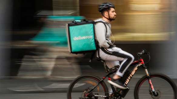A food delivery rider in Chinatown, Sydney.