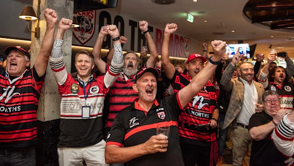 The North Sydney Bears fans celebrate following the announcement of the new Perth team.