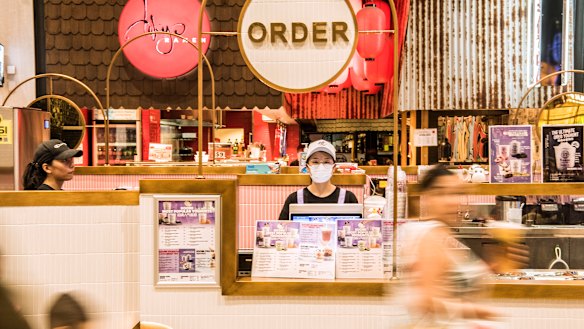Cloris Jiang waits to serve customers at the Koomi yoghurt drink outlet at the Macquarie Centre.