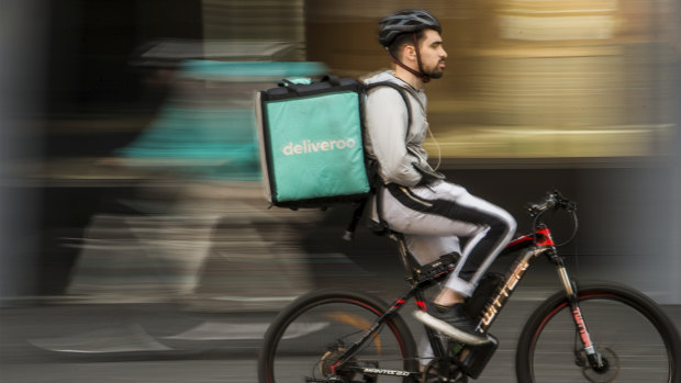 A food delivery rider in Chinatown, Sydney.