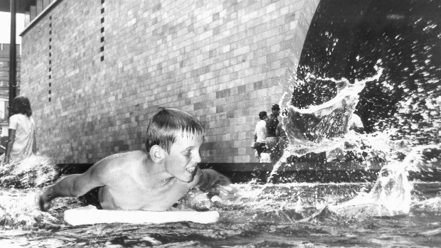 A boy splashes around in the NGV's exterior pool in 1968.