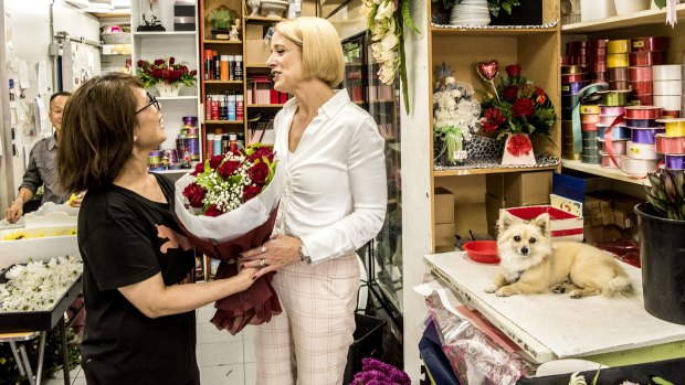 Kristina Keneally meets florist Kim Duong while campaigning in the Fowler electorate.